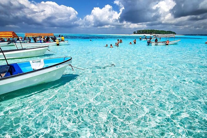 Boats in the shallows at Mnemba atoll